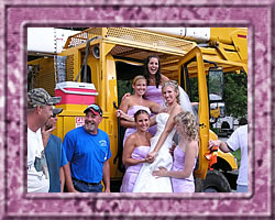 Wedding party posing on truck